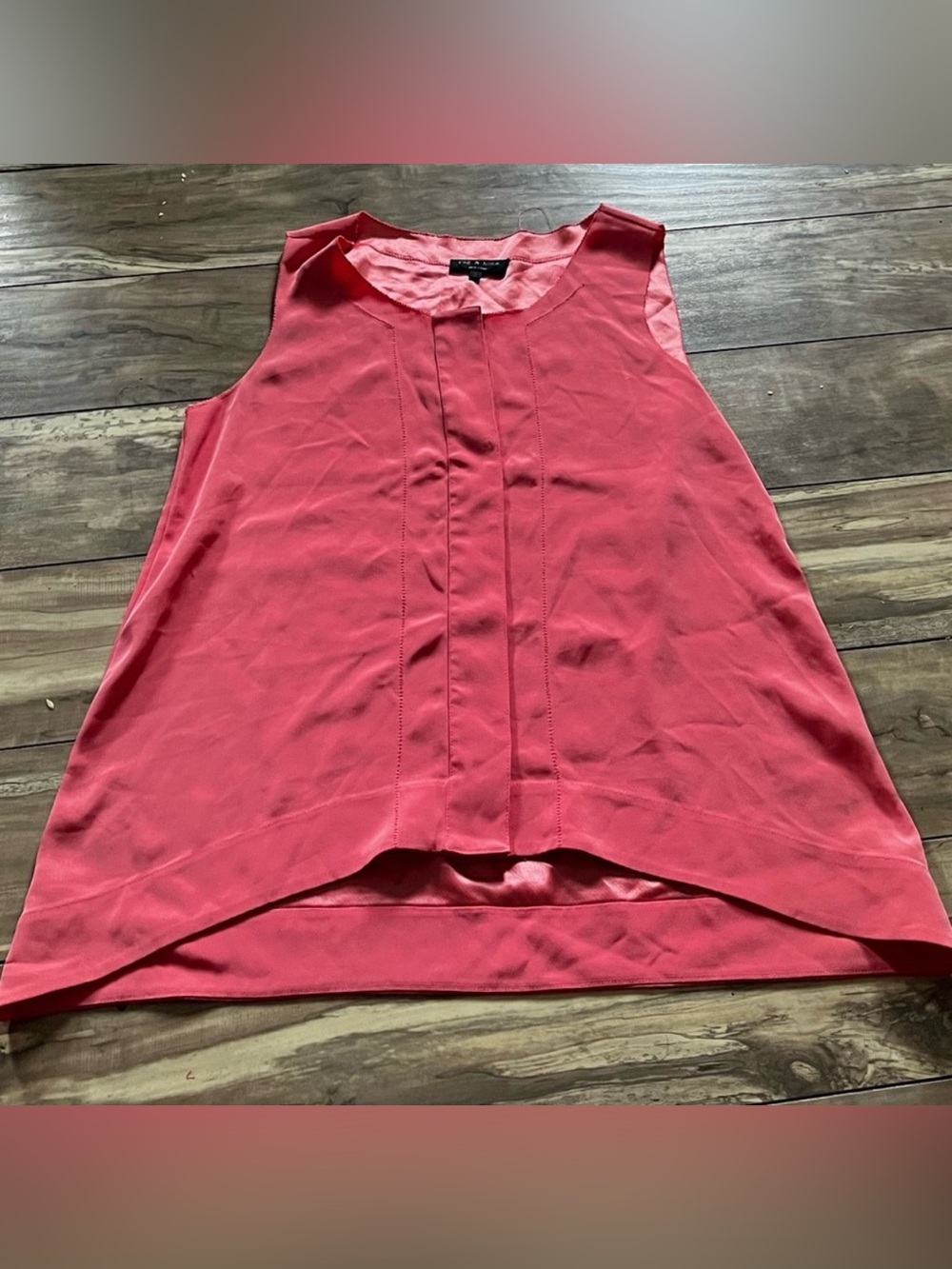 Rag & Bone pink sleeveless top featuring a front box pleat and a high-low hem